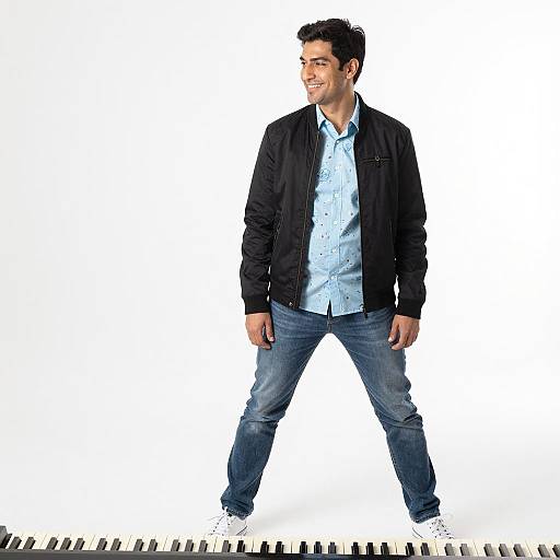 Stylish Man on Piano Keys Background