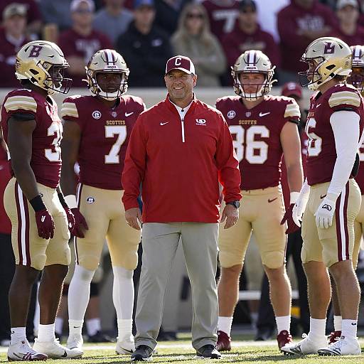 Football Coach and Players on Sidelines