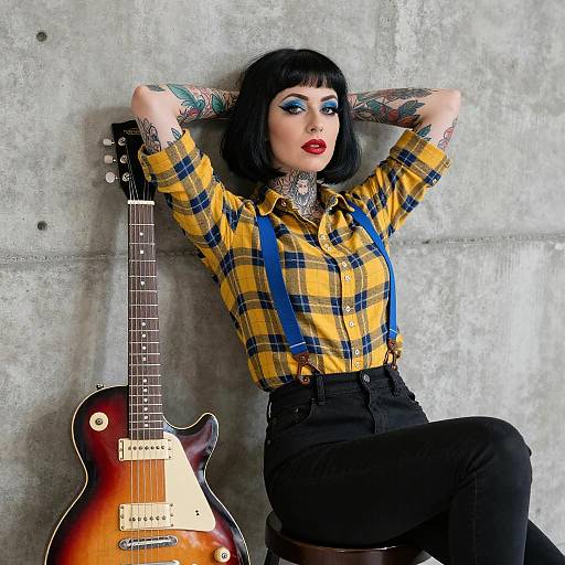 Tattooed Woman with Red Guitar