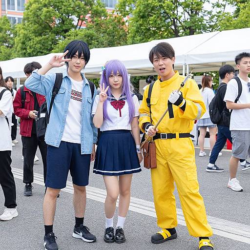 Photograph of three Asian cosplayers: a black-haired boy in a blue shirt, a purple-haired girl in a sailor uniform, and a black-haired