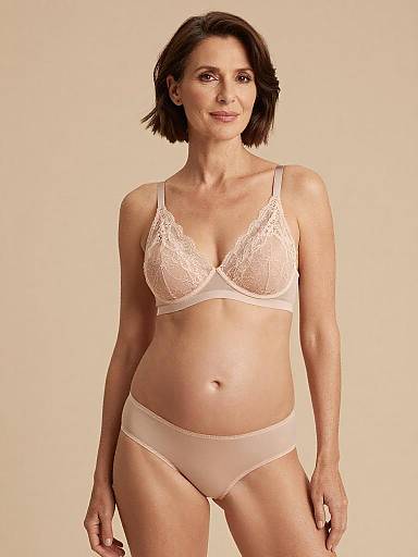Elegant Mature Woman in Blush Maternity Lingerie