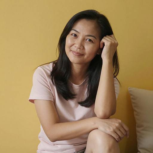 Portrait of Asian Woman by Yellow Wall