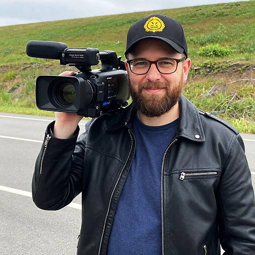 Bearded Man with Camera on a Hill