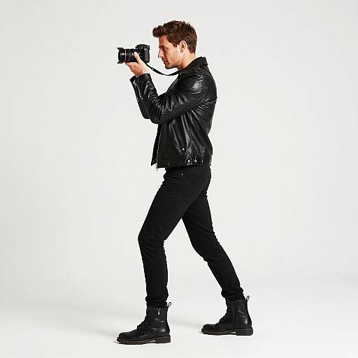 Confident Man with Camera in Black Leather