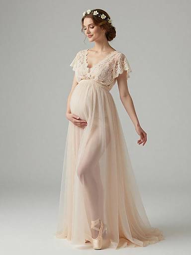Ethereal Pregnant Woman in Lace and Chiffon Gown