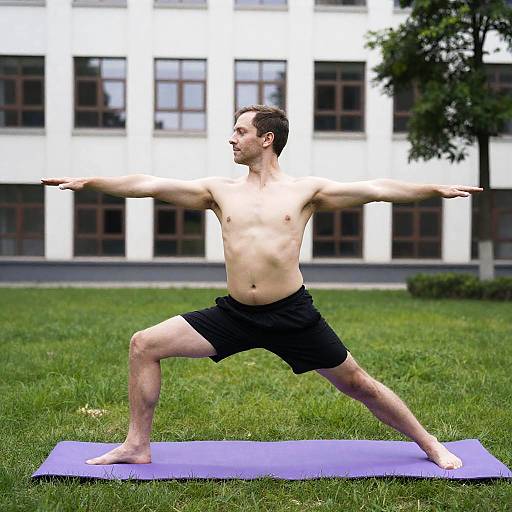 Man Doing Yoga Warrior Pose Outdoors