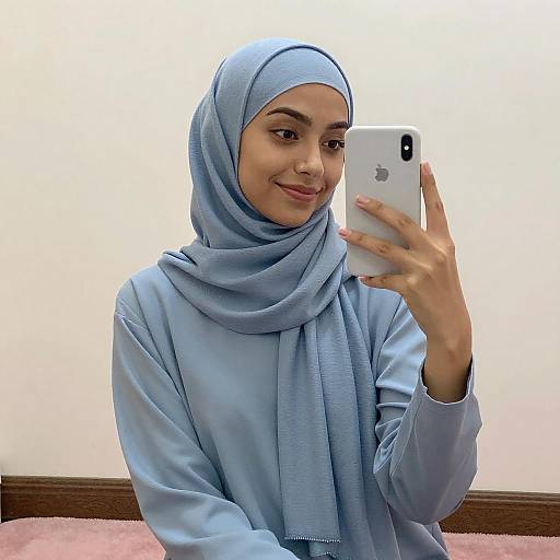 Young Woman in Blue Hijab Mirror Selfie