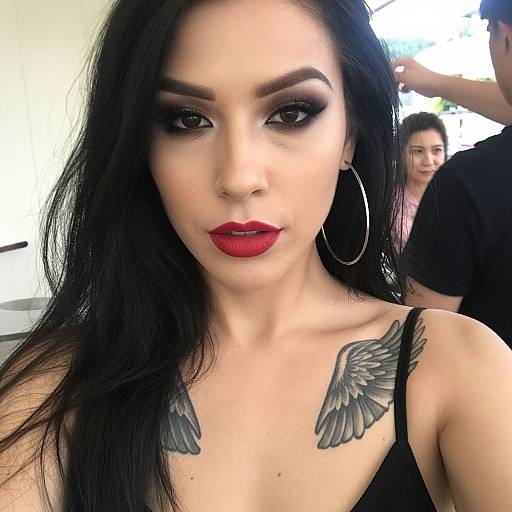 Bold Woman with Wing Tattoos