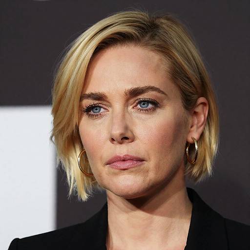 Serious Blonde Woman Portrait in Gold