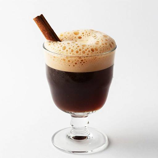 Dark Frothy Drink with Cinnamon Stick