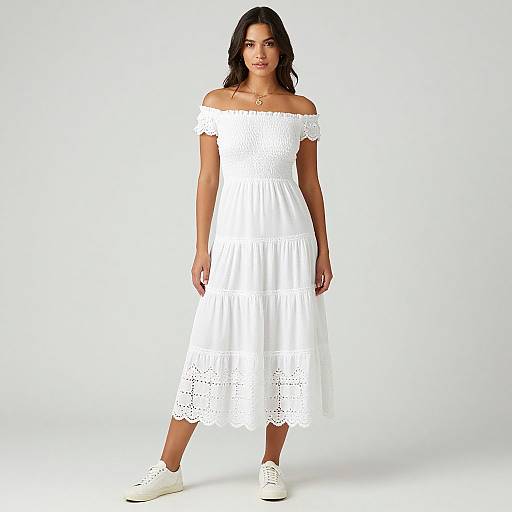 Photograph of a young woman with medium skin tone, dark wavy hair, wearing an off-shoulder white lace dress and white sneakers, standing