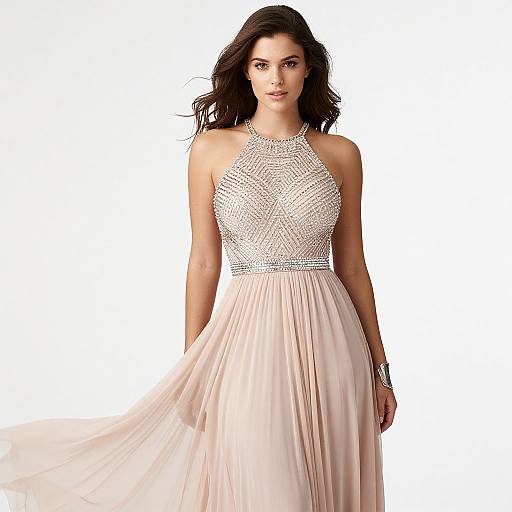 Photograph of a beautiful woman with dark wavy hair in a sleeveless, white halter gown with intricate lace bodice and flowing pink chiffon