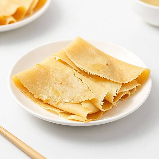 Golden Crepes on Minimalist Plate