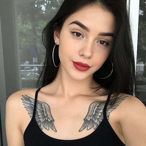 Confident Woman with Wing Tattoos