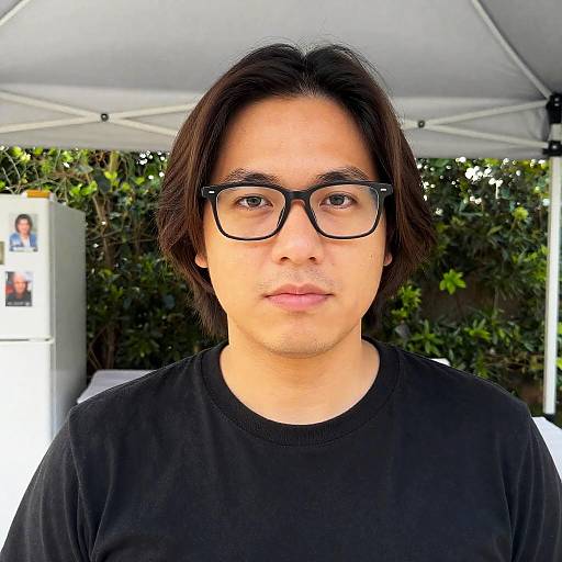 Portrait of Man with Glasses and Black T-shirt