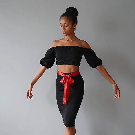 Woman in Black Two-Piece Outfit with Red Ribbon