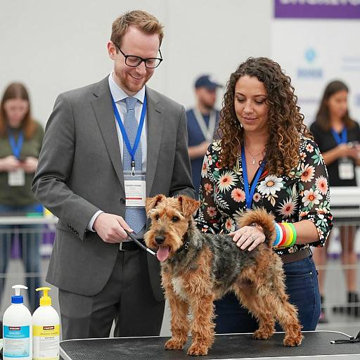 Man and woman with terrier at dog show