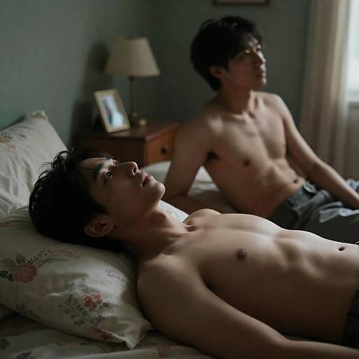 Intimate Bedroom Scene with Two Men