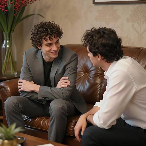 Two men having a conversation indoors