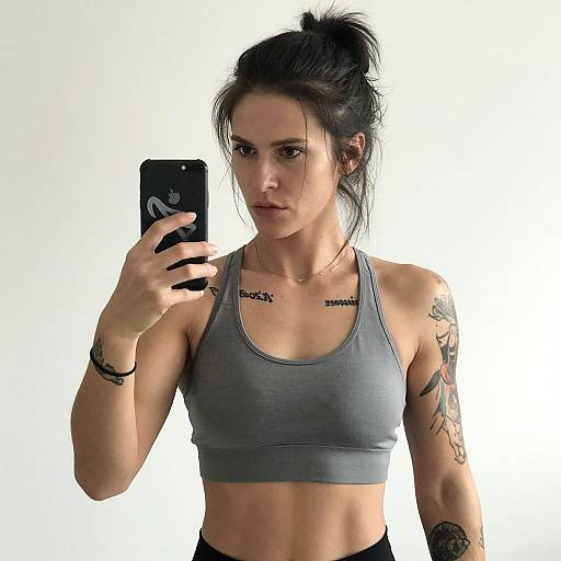 Tattooed Woman Selfie in Sports Bra
