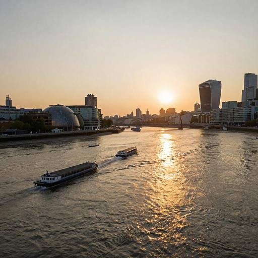 Serene River Sunset Over Urban Landscape