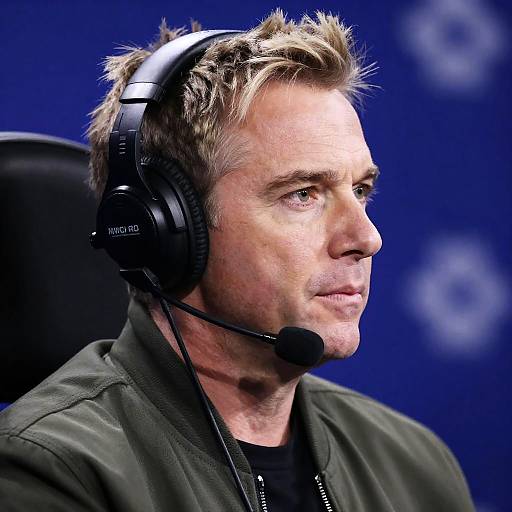 Focused Man with Headphones and Blue Lights