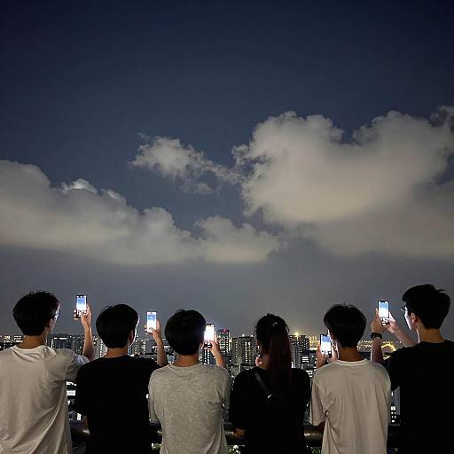 Group of Teenagers Taking Night Photos in City