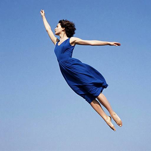 Woman in Sapphire Dress Mid-Air