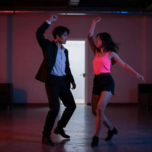 Neon Dance Couple in Dim Room