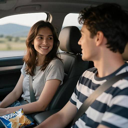 Young Couple in Car Smiling at Each Other