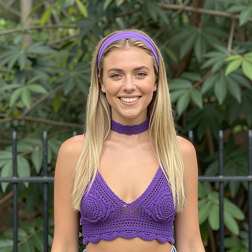 Blonde Woman in Purple Outfit Smiling