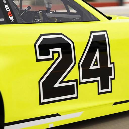 Photograph of a bright yellow race car with large black number 