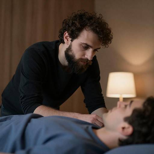 Contemplative Bearded Man at Bedside