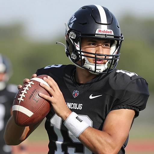 Focused Football Player in Black Gear