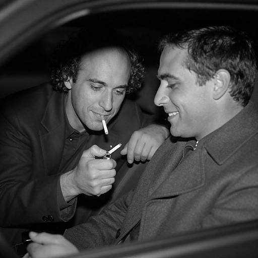 Two Men Lighting Cigarettes in Car at Night