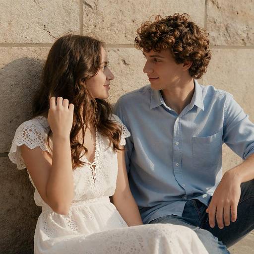 Sunlit Couple by Stone Wall