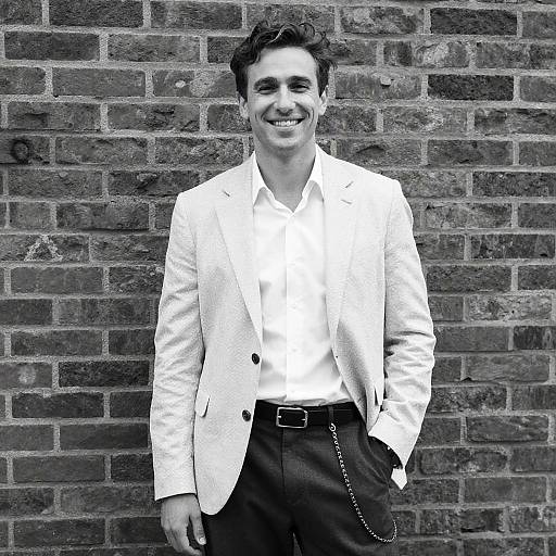 Smiling Man in Patterned Blazer