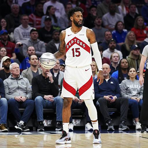 Toronto Raptors Basketball Player Holding Silver Basketball