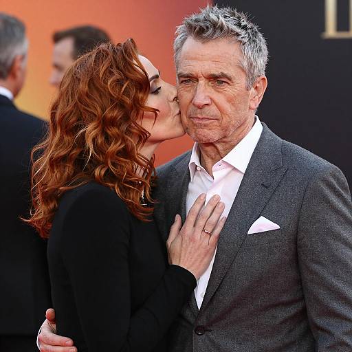 Woman Kissing Man on Cheek at Event