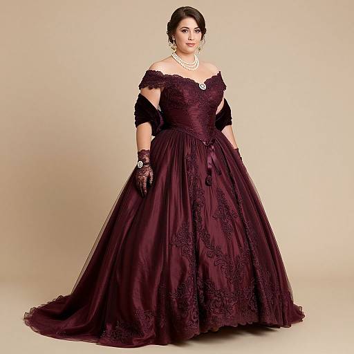 Photograph of a curvy woman with fair skin wearing an off-the-shoulder, dark purple, lace-embellished ball gown, black
