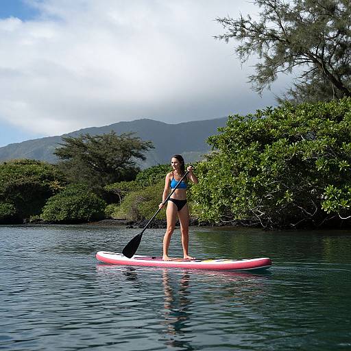 Woman Paddleboarding in Maui's Nature