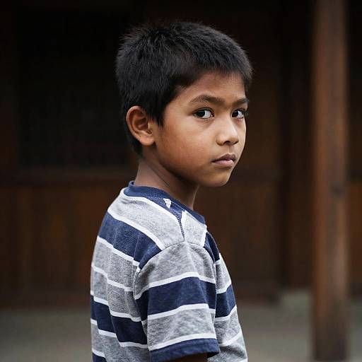 Serious Boy with Striped Shirt Portrait