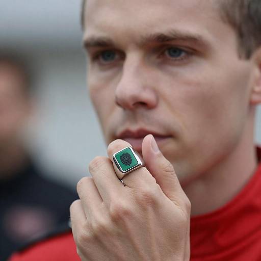 Intense Close-Up of Man in Red Uniform