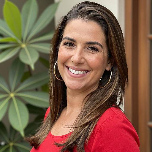 Smiling Woman with Gold Hoops and Plant