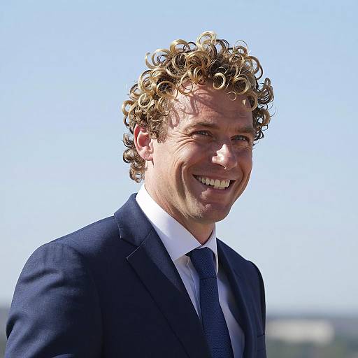 Smiling Man in Blue Suit under Sky