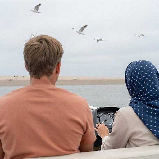 Couple in Boat with Birds Flying Overhead