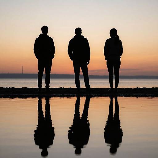 Silhouetted Figures at Sunset Reflection