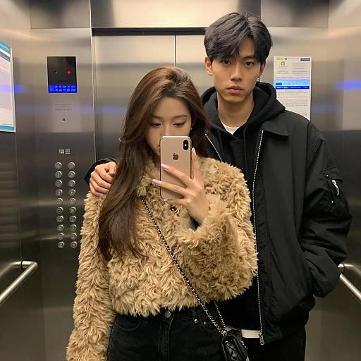 Young Couple Taking a Selfie in Elevator