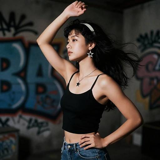 Stylish Woman Posing in Urban Graffiti Setting