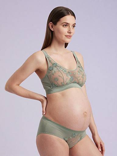 Pregnant Woman in Sage Green Maternity Lingerie